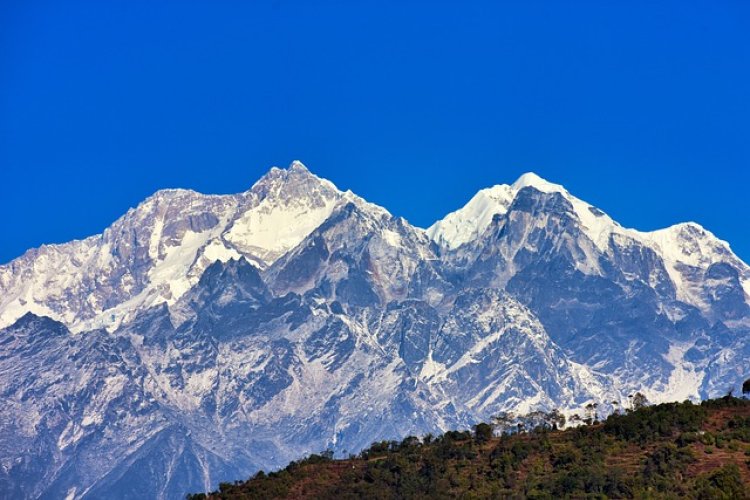 A hiker approaching the base of Kangchenjunga 